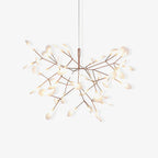 Rose gold branch chandelier glowing in an elegant space