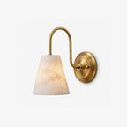 This brushed brass Clérachic wall sconce shows the soft veining of its alabaster cone shade on a plain grey background.