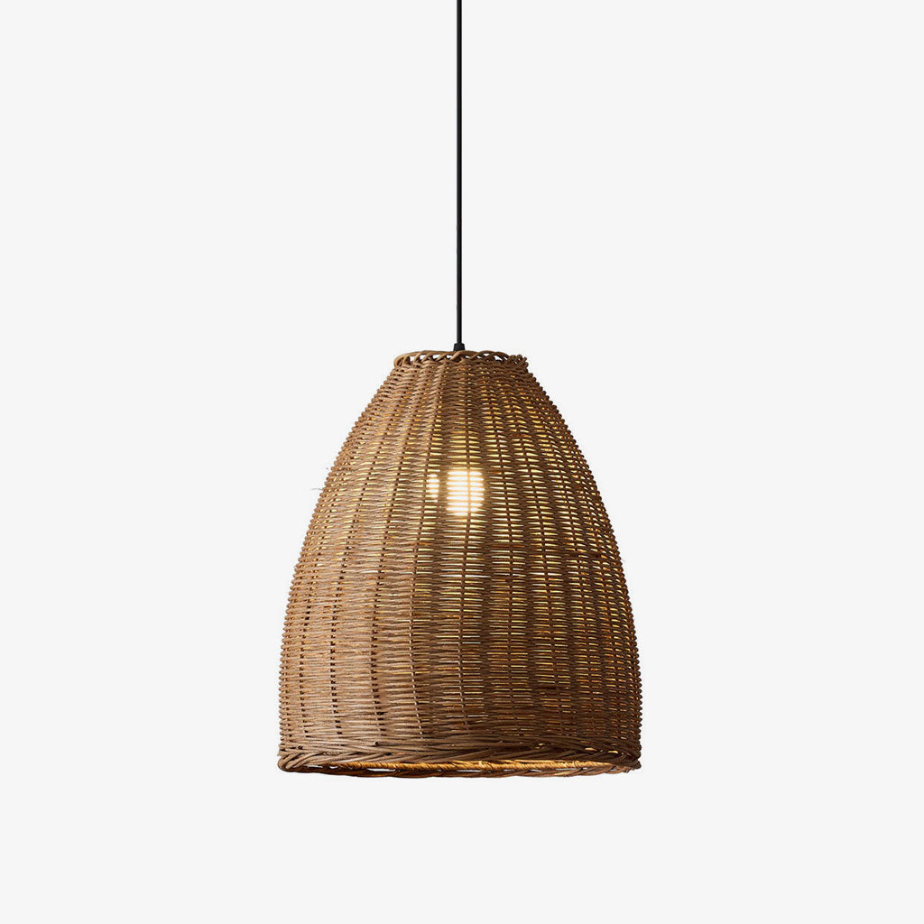 This Clérachic pendant's bell-shaped rattan shade glows warm, its hand-woven texture shown against a plain backdrop.