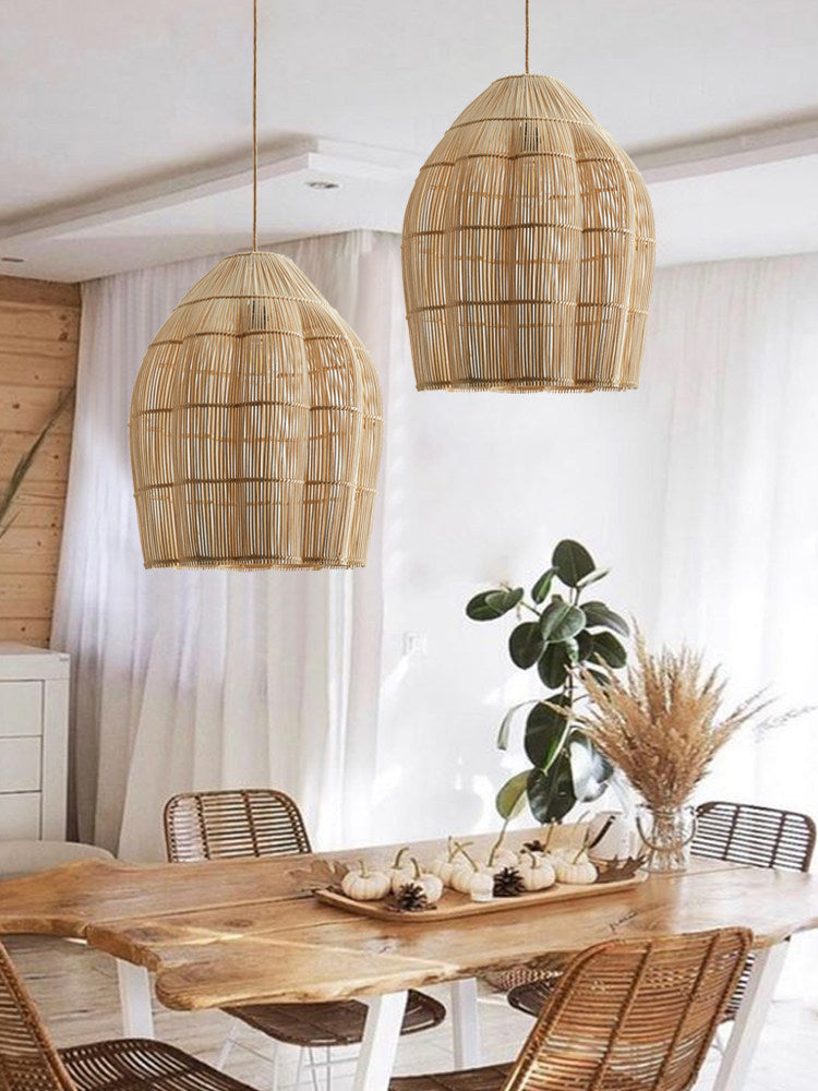 Two of this Clérachic pendant hang side by side above a live-edge wood table, sheer curtains behind.