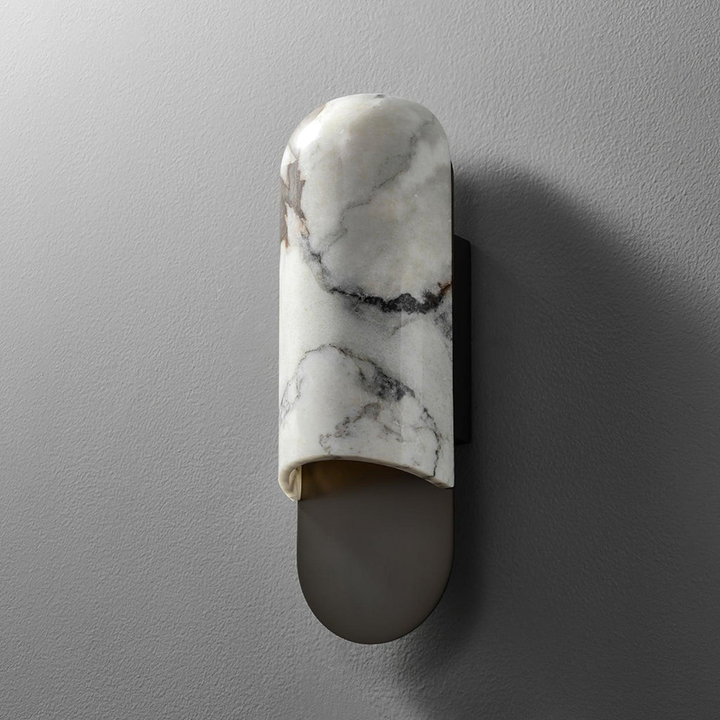 Clérachic marble cylinder wall light photographed straight-on and unlit against a plain grey wall.