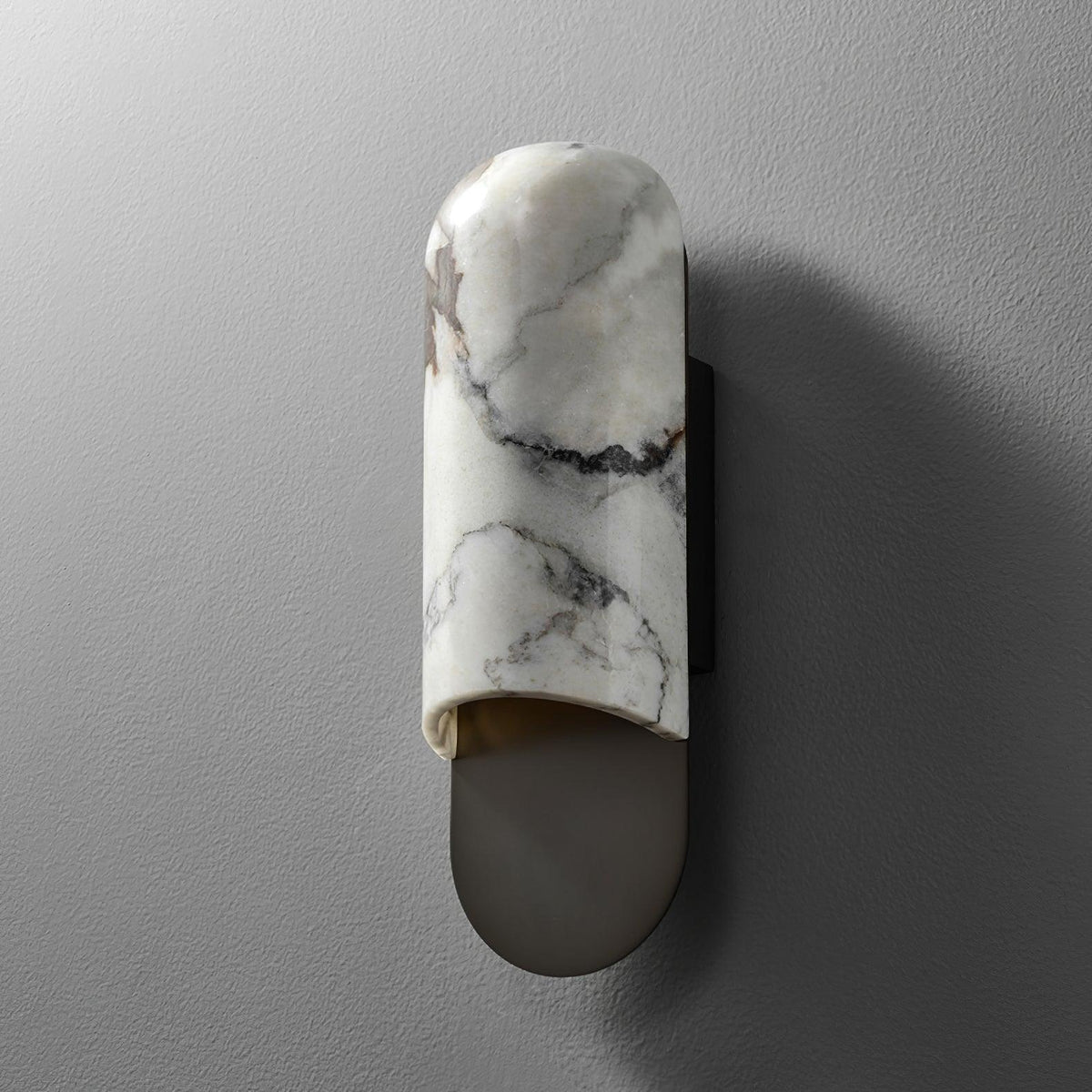 Clérachic marble cylinder wall light photographed straight-on and unlit against a plain grey wall.