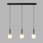 Three slim black-and-white Clérachic sphere pendants hang from a black bar against plain grey.