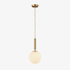 This Clérachic sphere pendant in brass and white hangs from its round ceiling canopy on white.