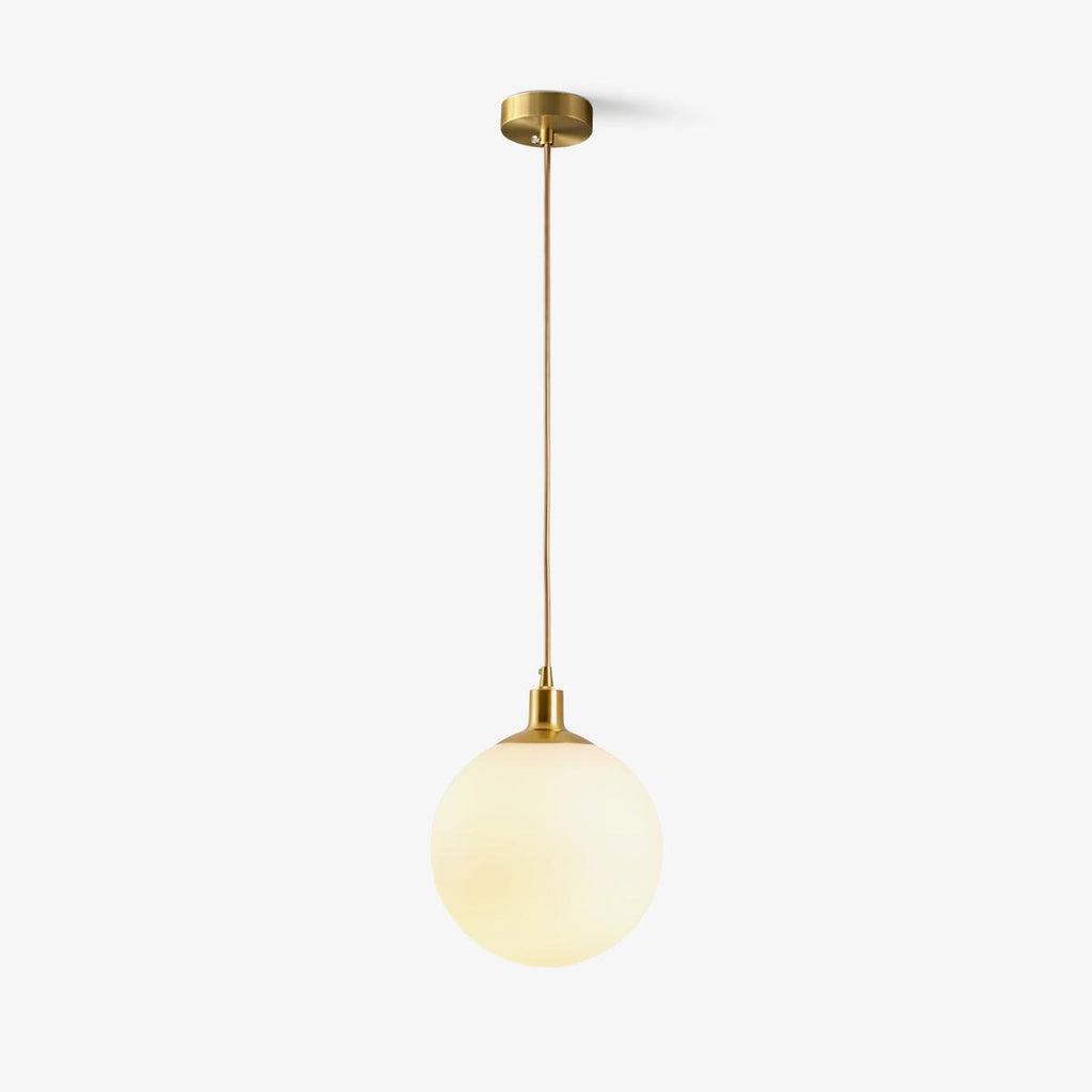 This Clérachic sphere pendant hangs from a rigid brass stem against a plain white backdrop.