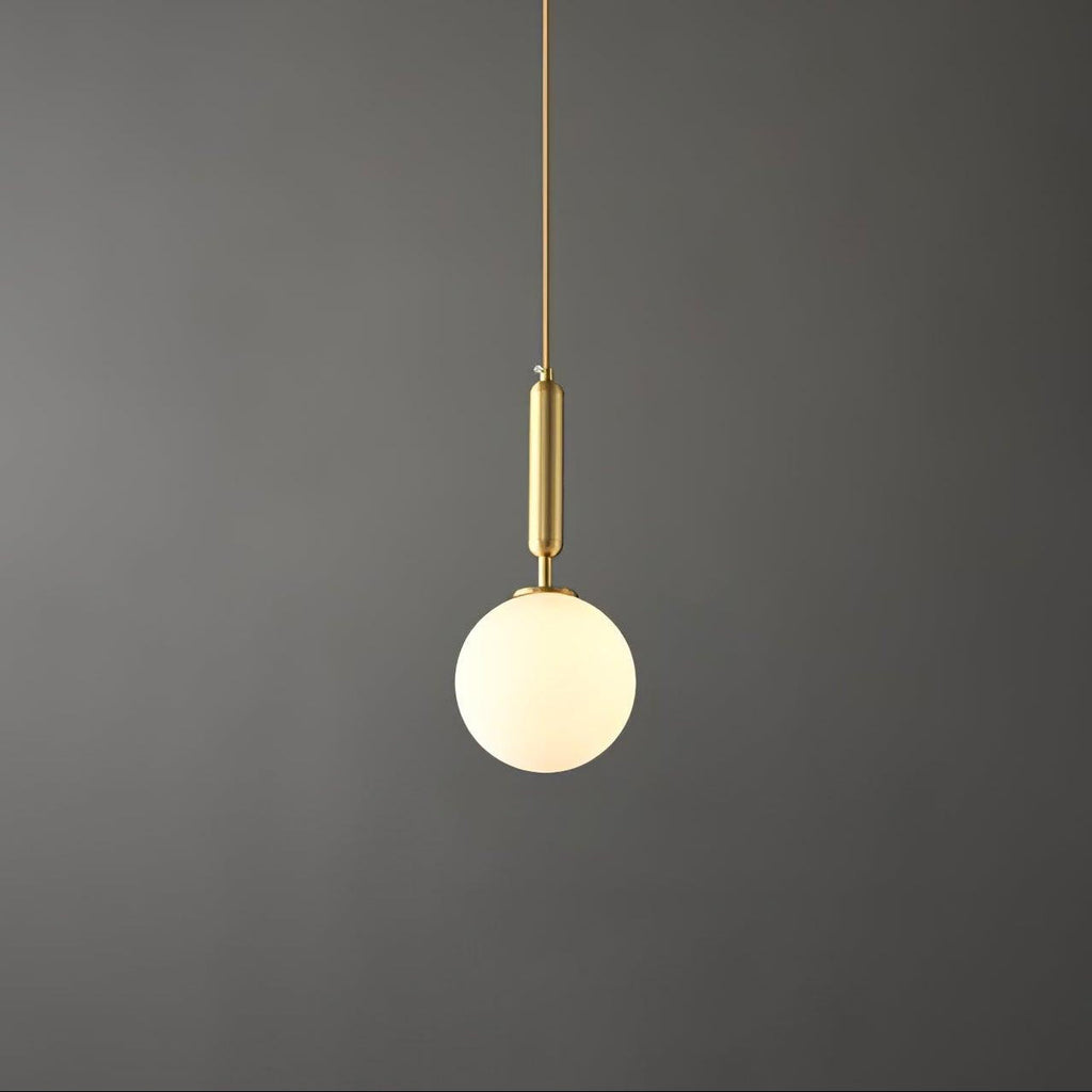 Against the same dark grey backdrop, a brass-and-white Clérachic sphere pendant hangs lit.