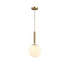 A single brass-and-white Clérachic sphere pendant hangs on a straight cord against plain white.