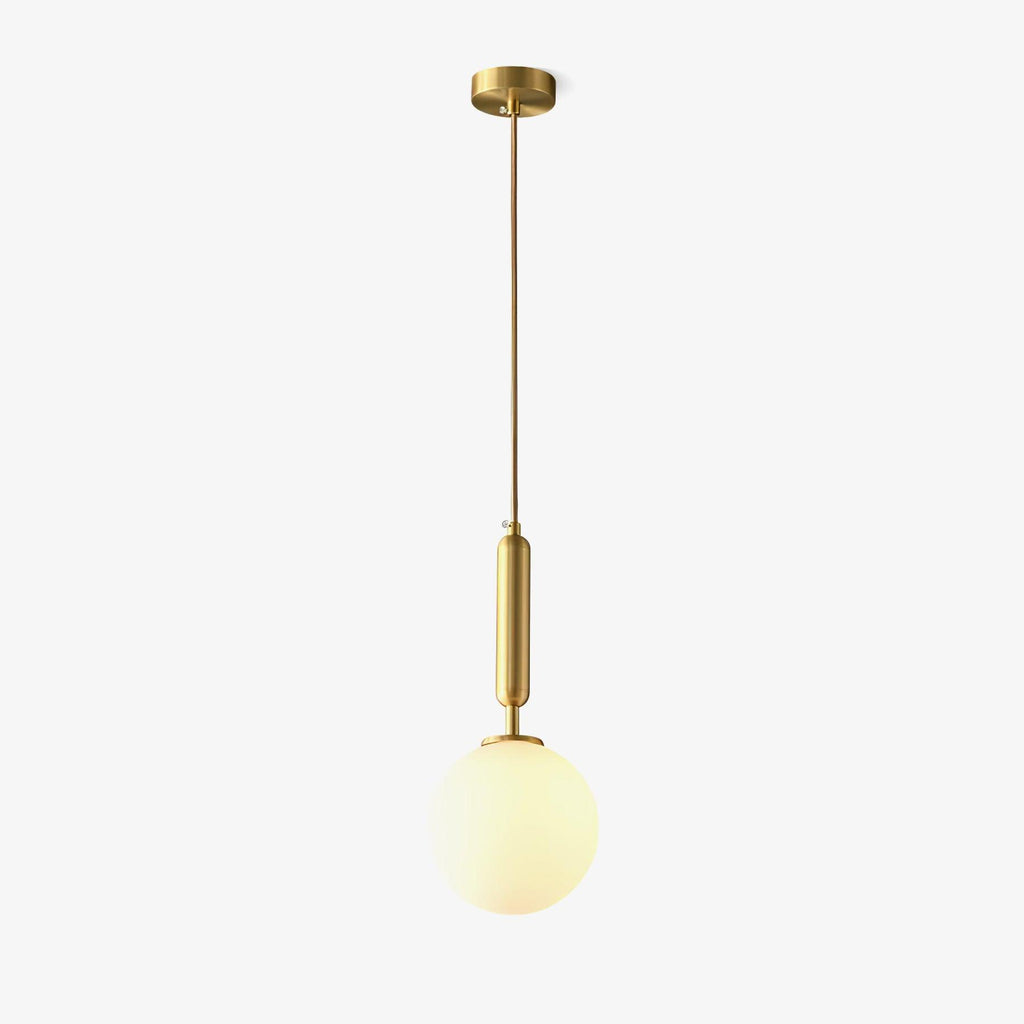 A single Clérachic sphere pendant on a rigid brass stem hangs lit against an off-white backdrop.
