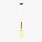 A single Clérachic sphere pendant on a rigid brass stem hangs lit against an off-white backdrop.