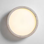 Seen face-on and lit, this Clérachic ceiling light glows warmly across its full white centre panel.