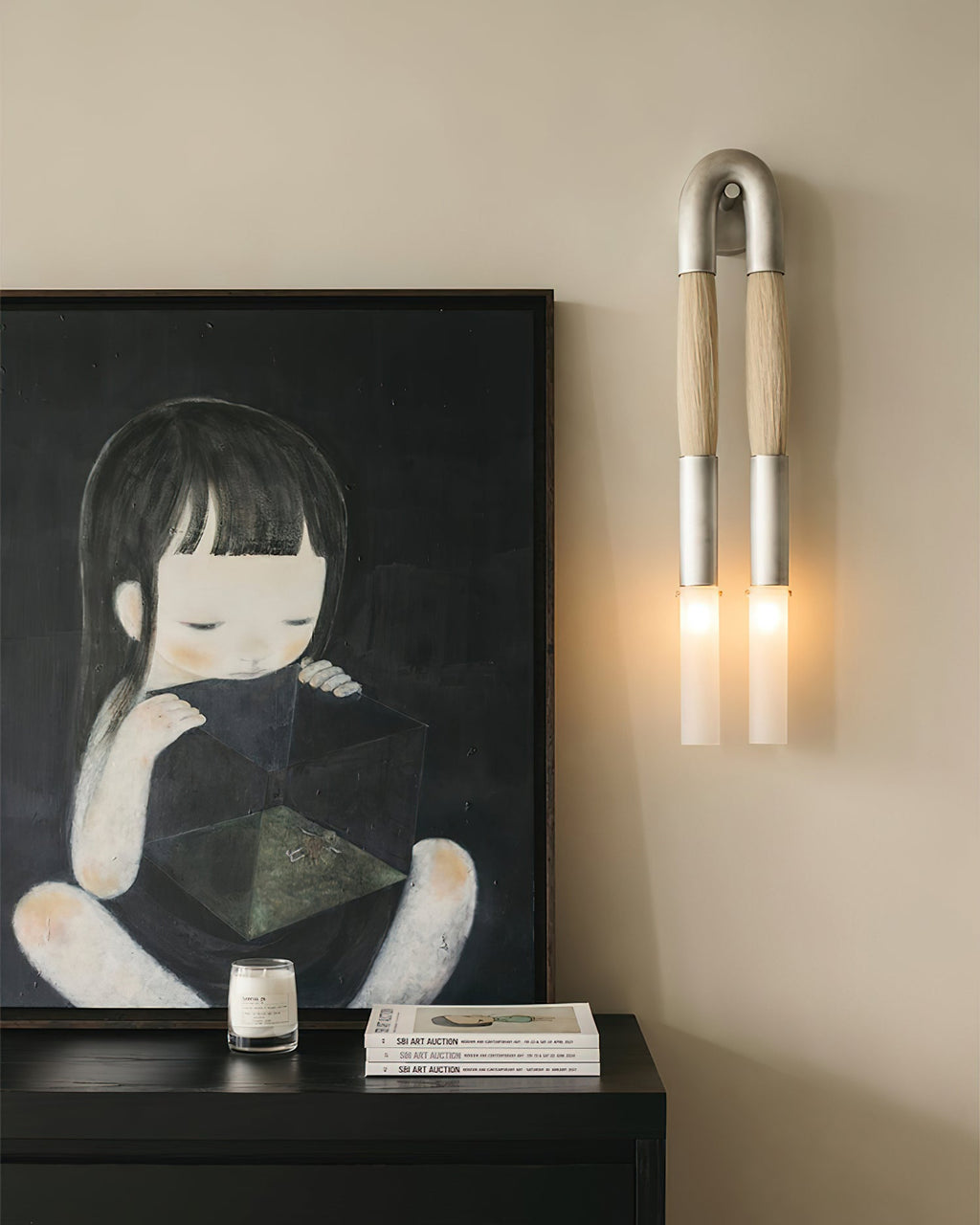 Horsehair wall lamp glowing beside a dark interior wall