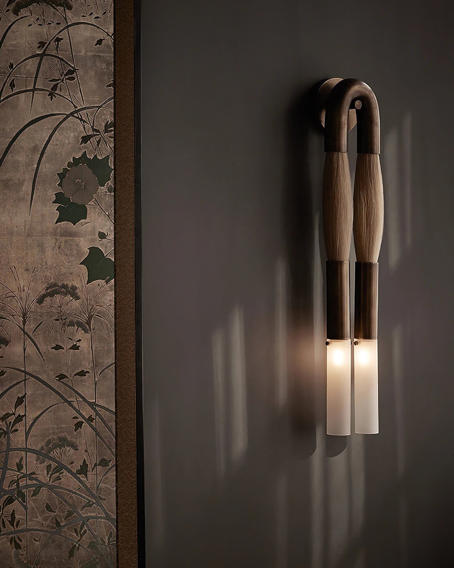 Horsehair wall lamp mounted on a wall casting soft warm light