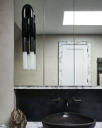 Horsehair wall lamp with iron mane and white glass shade lit