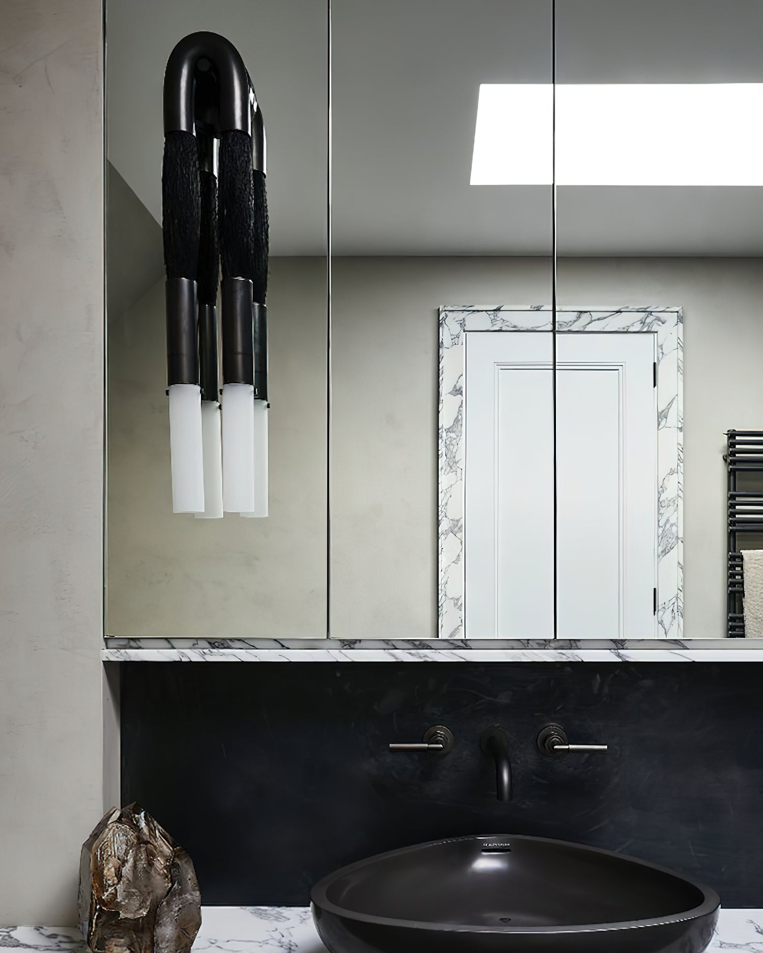 Horsehair wall lamp with iron mane and white glass shade lit