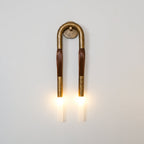 Horsehair wall lamp with flowing mane and white glass shade lit