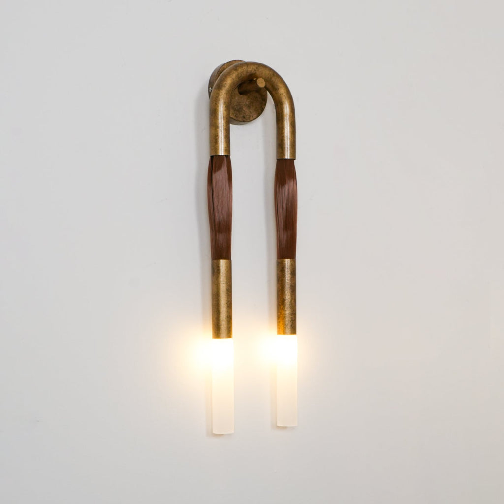 Horse mane wall lamp with white glass shade and iron frame