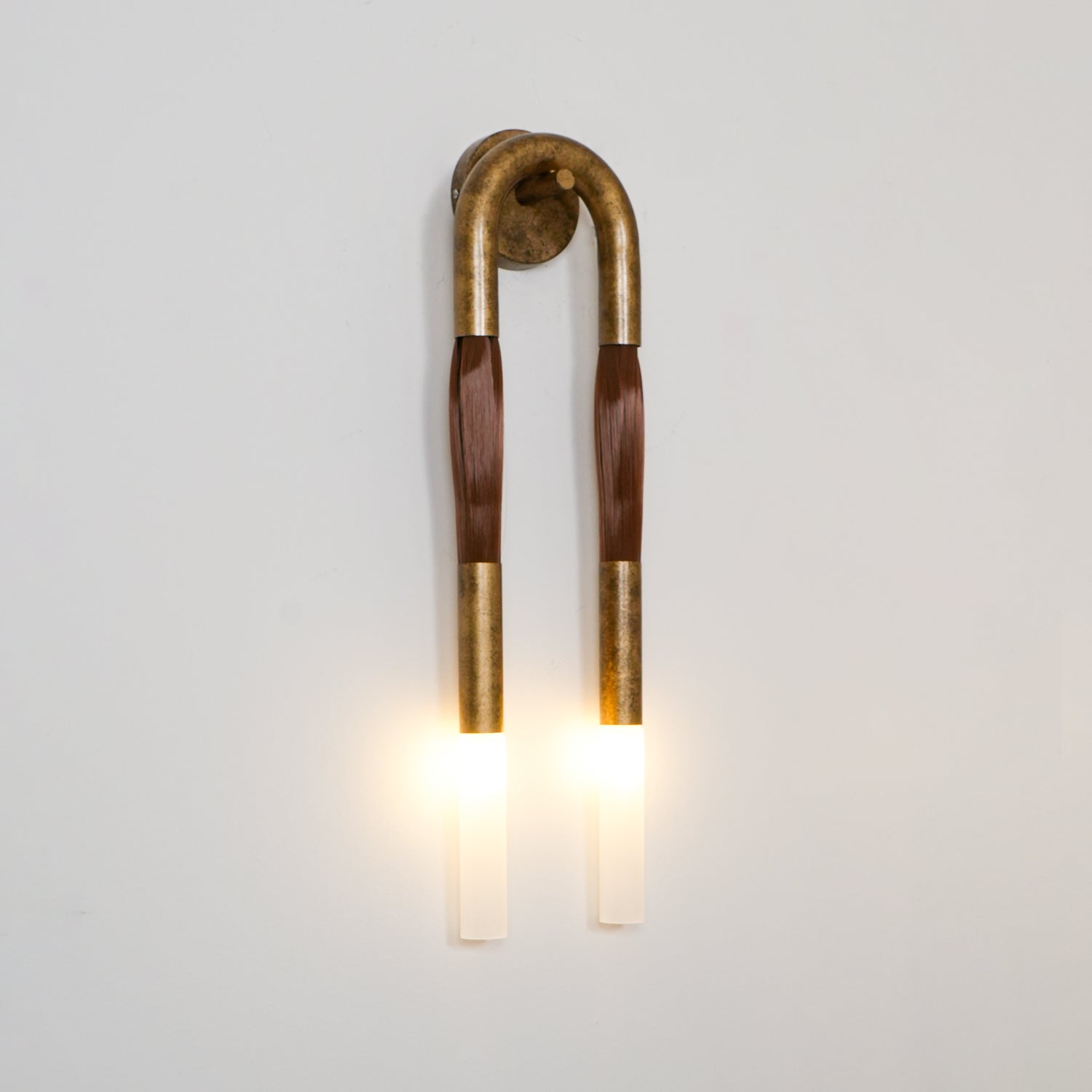 Horse mane wall lamp with white glass shade and iron frame