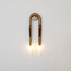 Wrought-iron horsehair wall lamp with glowing glass shade