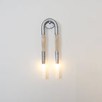 Sculptural horse mane wall lamp glowing in a styled room