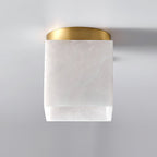 Straight-on view of the Usilia ceiling light, unlit, the round brass canopy above the square alabaster shade.