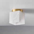 Angled view of the Usilia alabaster ceiling light, showing the grey vein running diagonally across the stone cube.