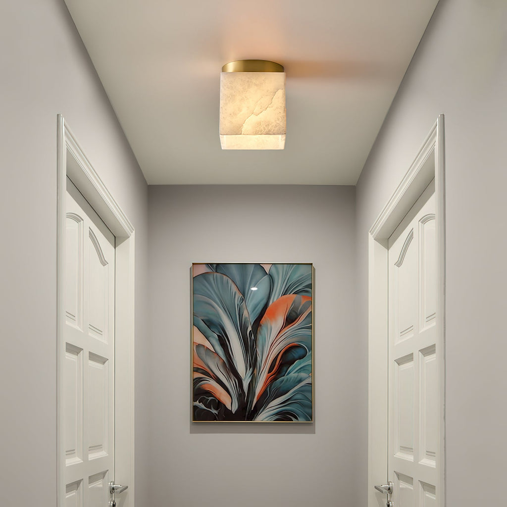 Usilia alabaster ceiling light lit in a narrow white corridor between two panelled doors.