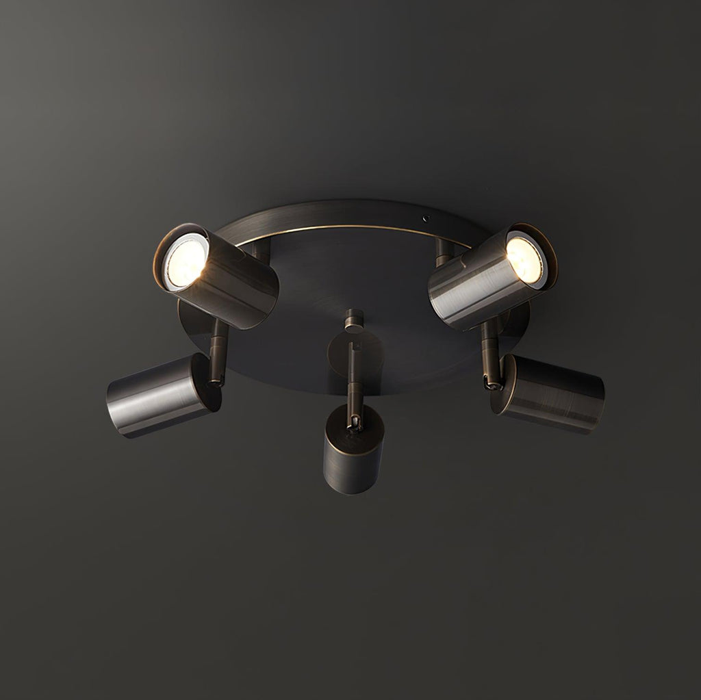 Black barrel-form spotlight ceiling light mounted on a ceiling