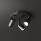 Barrel-form spotlight ceiling light angled over a kitchen island