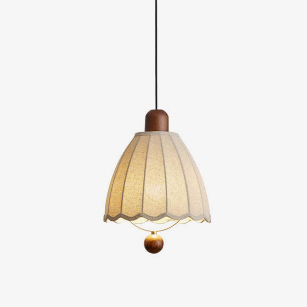 On a plain backdrop, this Clérachic pendant shows its fluted beige shade and wood ball finial beneath the cap.