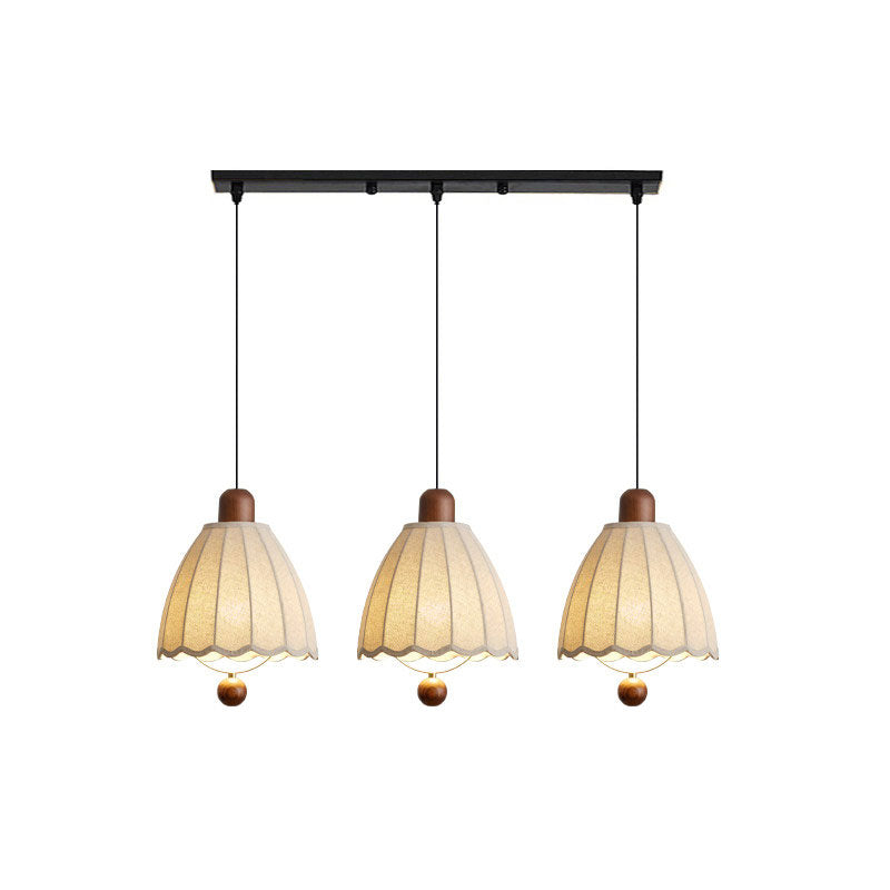 Along a linear plate, three of these Clérachic pendants hang at matched lengths on a white backdrop.