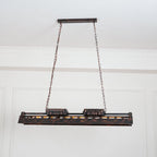 Industrial steampunk chandelier detail showing rust finish and sockets