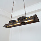 Industrial rust iron chandelier lighting a kitchen island
