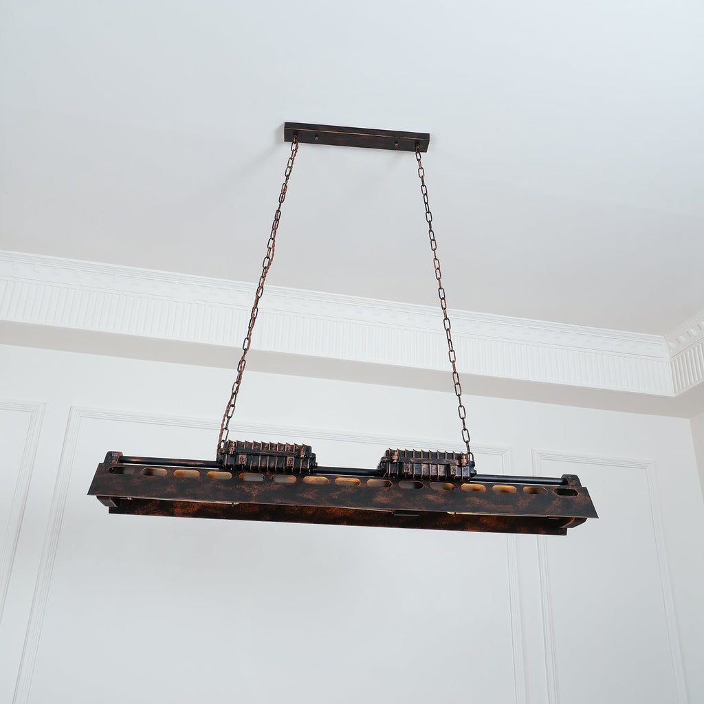 Rust iron Edison chandelier casting amber light in a bar setting
