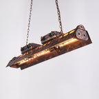 Rust iron steampunk chandelier glowing with warm amber Edison light