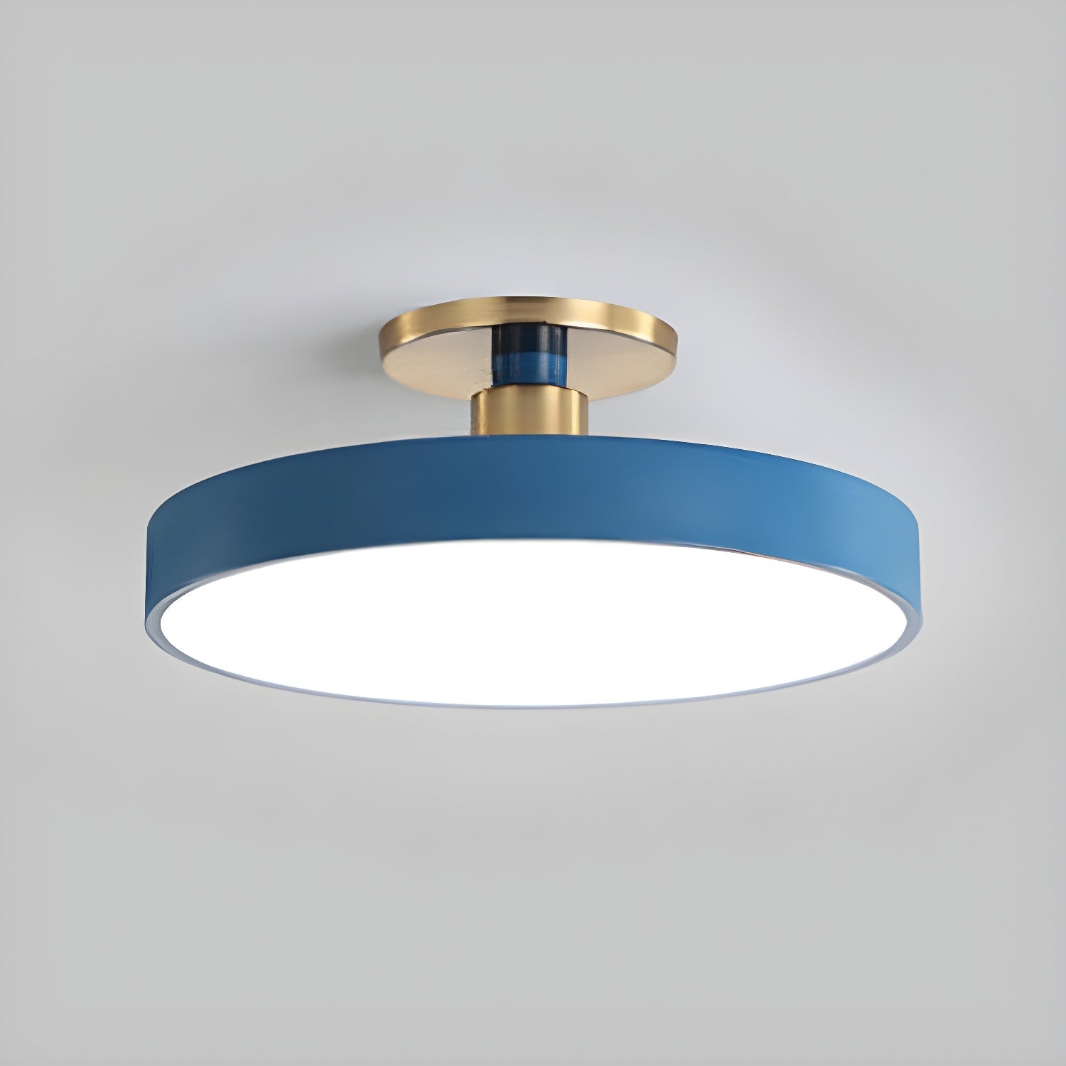 Flush mount ceiling light in blue with white diffuser and gold trim