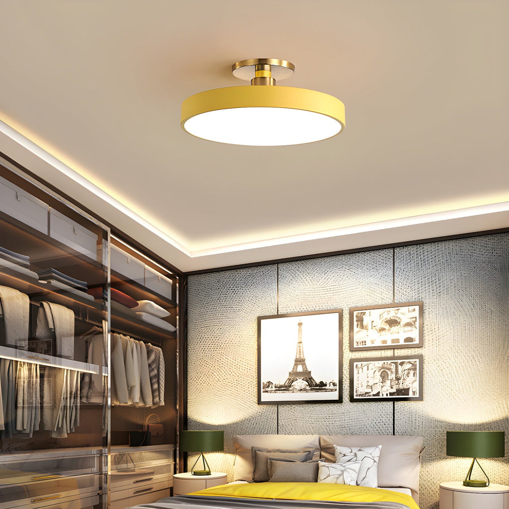 Flush mount ceiling light glowing softly above a seating area