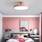 Flush mount ceiling light glowing softly in a modern office