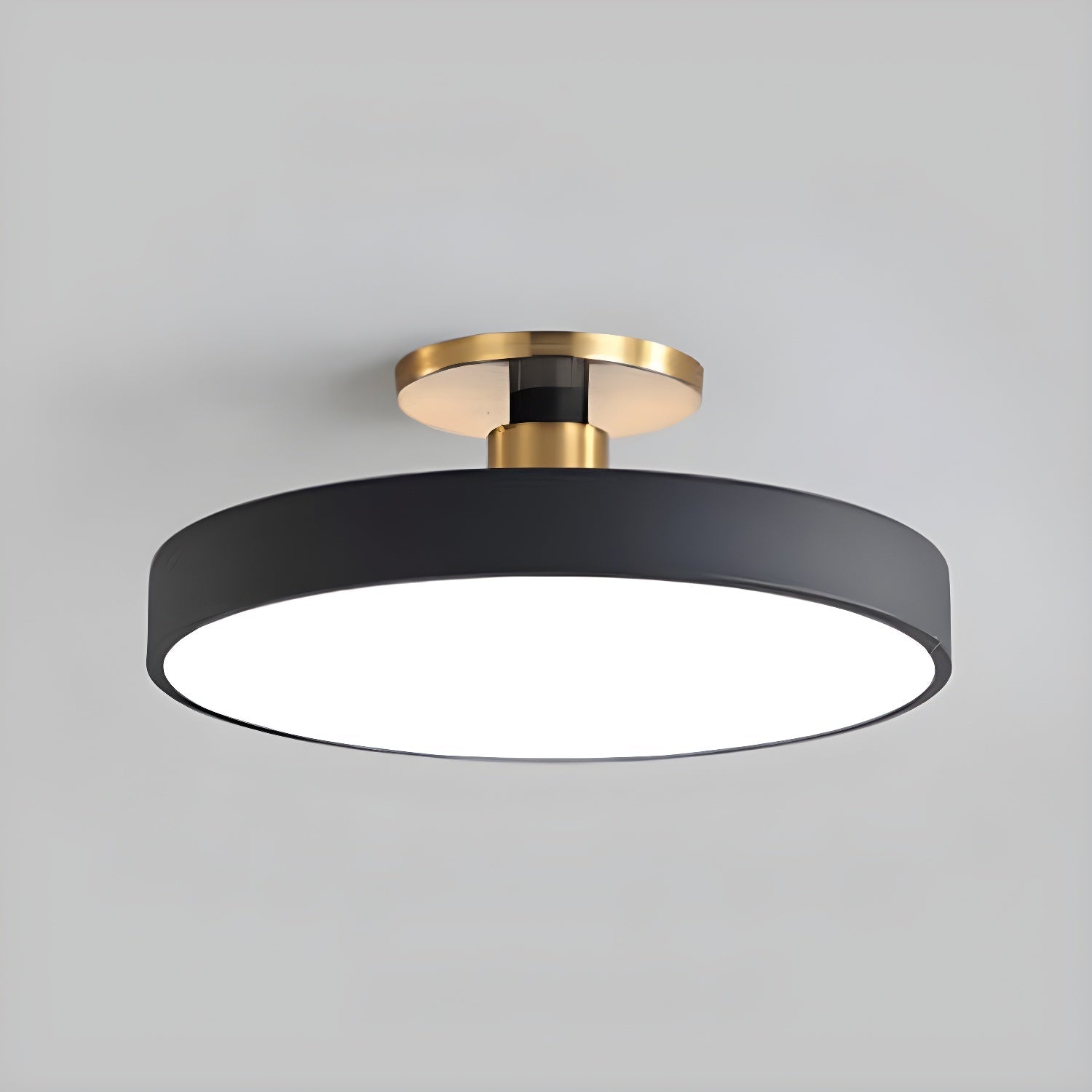 Flush mount ceiling light glowing softly against a white ceiling