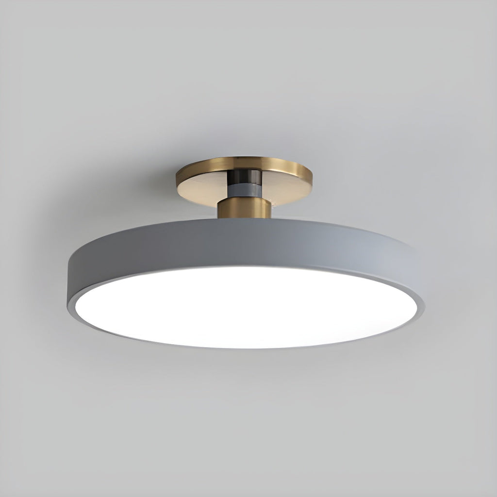 Flush mount ceiling light with white acrylic diffuser and gold trim