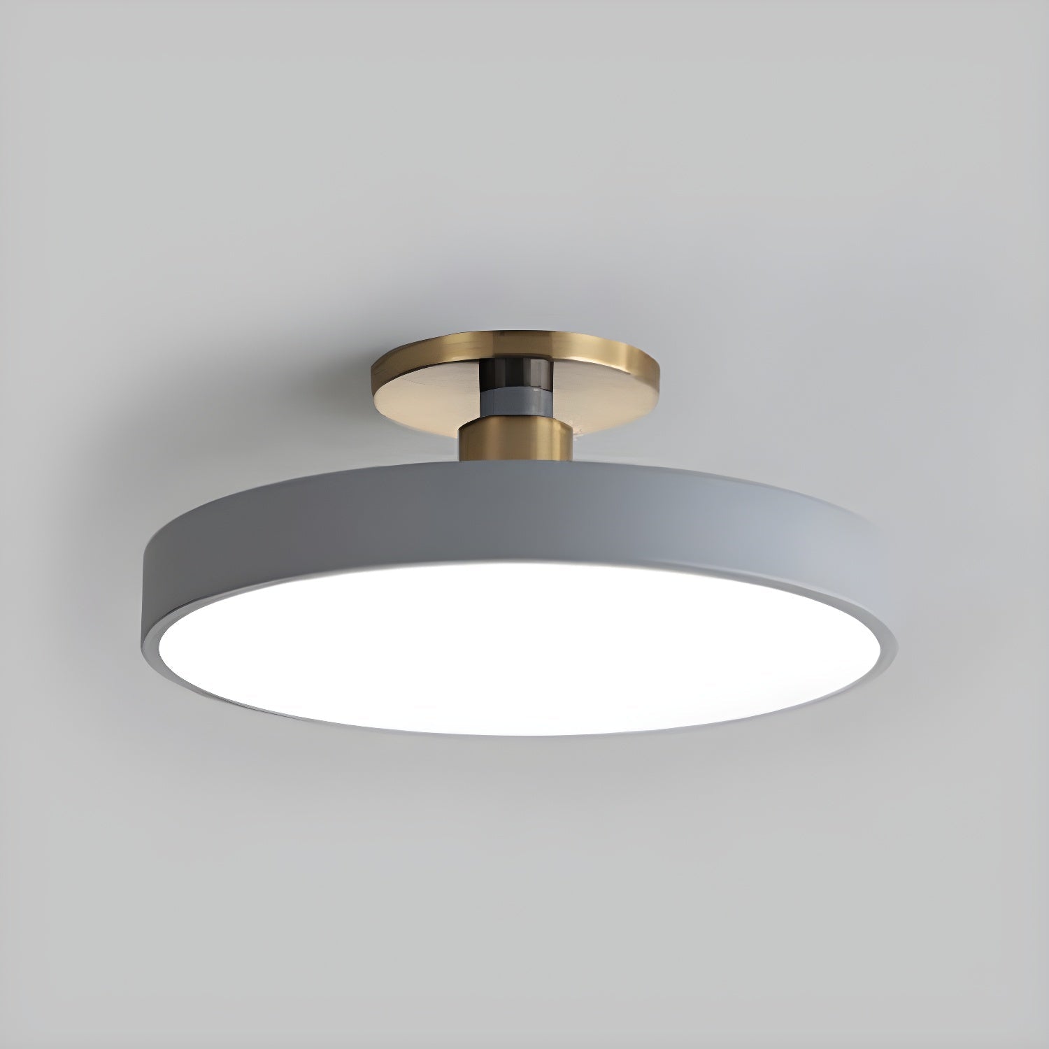 Flush mount ceiling light with white acrylic diffuser and gold trim