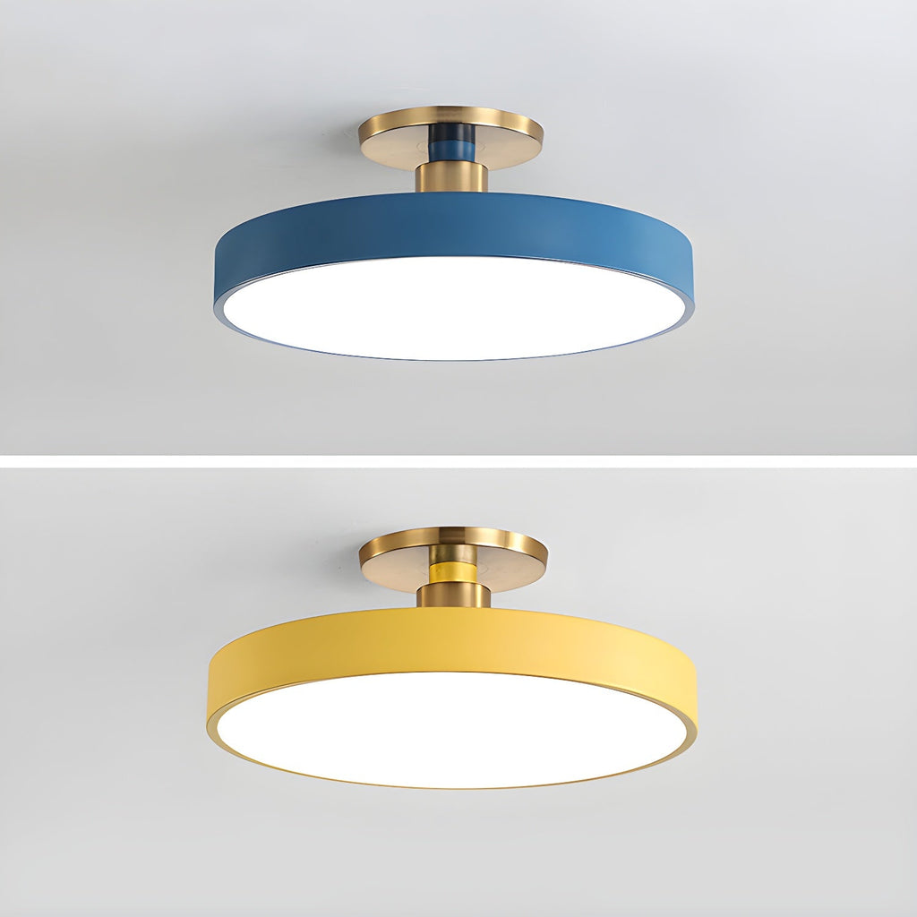 Flush mount ceiling light in pink with white diffuser glowing