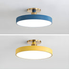 Flush mount ceiling light in pink with white diffuser glowing
