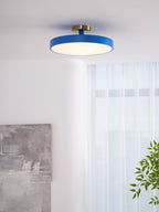 Flush mount ceiling light with wide diffuser spreading warm light