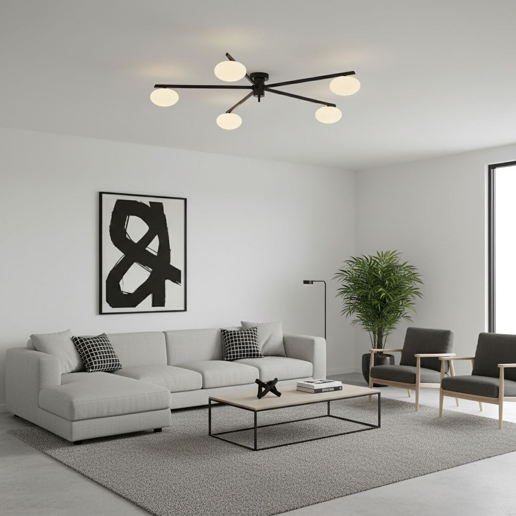 Black multi-arm ceiling light with sculptural white glass ovals