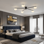 Black sputnik ceiling light with white oval glass shades on arms