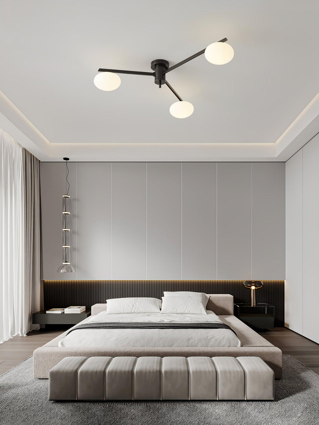 Brass ceiling light with white oval glass shades lit in a room