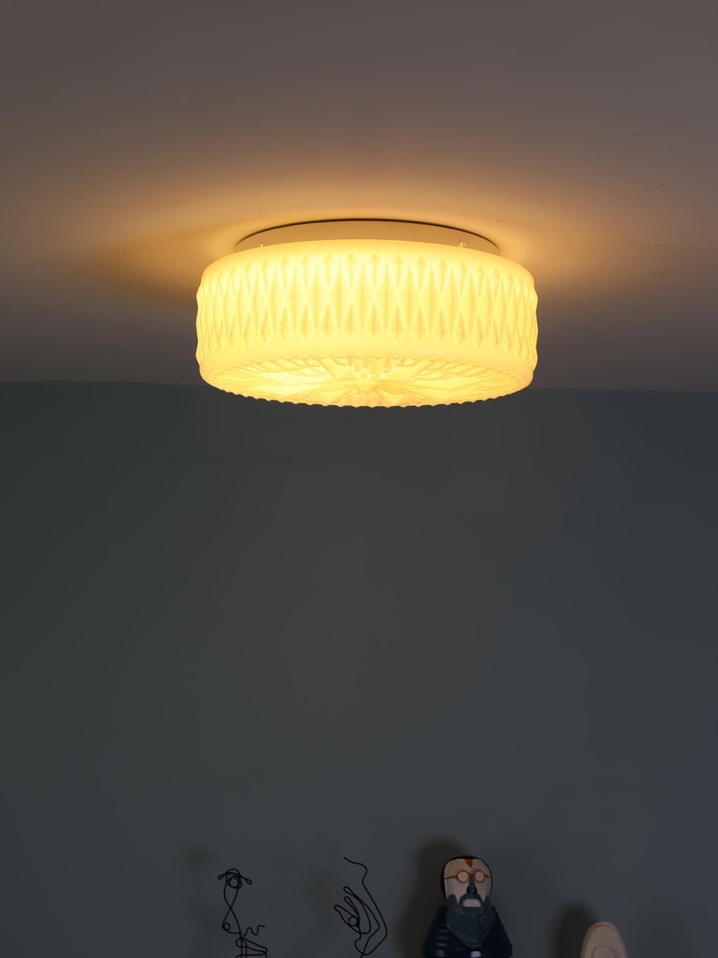 Adler ceiling light mounted against a neutral ceiling
