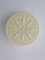 Adler ceiling light shown casting soft ambient light