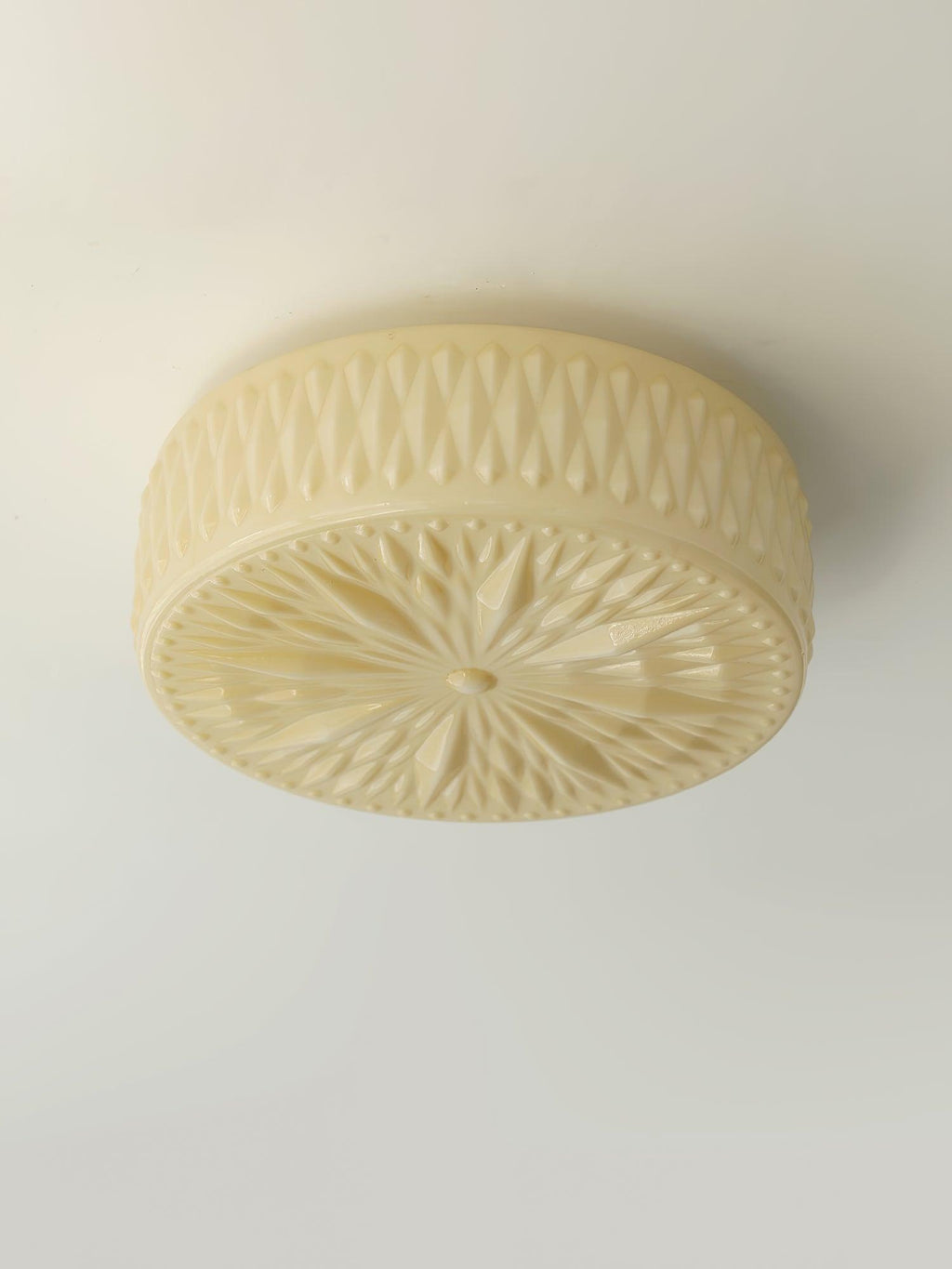 Adler ceiling light with white shade glowing softly