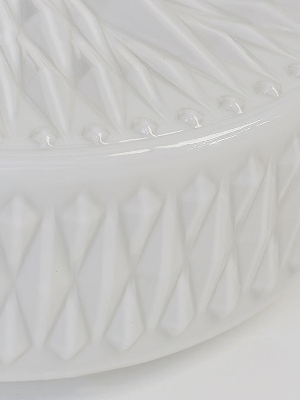 Adler ceiling light shown lit with a warm glow